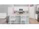 Modern kitchen featuring a granite island with bar seating, and white cabinets at 352 Matuskovic Dr, Charleston, SC 29414