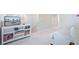 Upstairs living area with a couch, TV, shelving unit, and neutral decor, providing a cozy and functional space at 352 Matuskovic Dr, Charleston, SC 29414