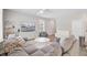 Cozy living room with a large couch, mounted TV, and bright neutral color palette at 352 Matuskovic Dr, Charleston, SC 29414