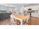 Open-concept living space with dining area, kitchen, and cozy living room with a large TV for entertainment at 352 Matuskovic Dr, Charleston, SC 29414