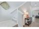 Bright stairway featuring carpeted steps, a decorative basket, and a view into the living area, adding visual interest at 352 Matuskovic Dr, Charleston, SC 29414