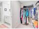 A well-organized walk-in closet that is off of the bathroom with shelving and clothing rods at 352 Matuskovic Dr, Charleston, SC 29414