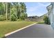 A wide-open backyard with a patio and a view of the wooden fence and trees at 354 Beachgrass Ln, Summerville, SC 29486