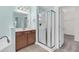 Bright bathroom featuring a glass enclosed shower, soaking tub, and stylish vanity with modern fixtures at 354 Beachgrass Ln, Summerville, SC 29486