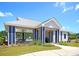 Community clubhouse with an outdoor pavilion that overlooks pool and is surrounded by lush landscaping at 354 Beachgrass Ln, Summerville, SC 29486