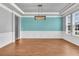 Dining room featuring wainscoting, views, and an eye-catching pendant light at 354 Beachgrass Ln, Summerville, SC 29486