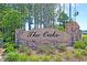 Welcome to The Oaks, an inviting community entrance sign with lush landscaping and elegant lighting at 354 Beachgrass Ln, Summerville, SC 29486