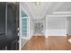 Bright foyer showcasing wood floors, decorative trim, and a view into adjacent rooms at 354 Beachgrass Ln, Summerville, SC 29486