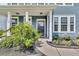 Charming front porch with classic white columns and well-maintained landscaping at 354 Beachgrass Ln, Summerville, SC 29486