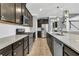 An open kitchen boasts stainless steel appliances, granite counters, and ample cabinet space at 354 Beachgrass Ln, Summerville, SC 29486
