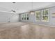 Bright living room features plenty of natural light from many windows and ceiling fan at 354 Beachgrass Ln, Summerville, SC 29486