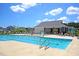 Community pool features lounge chairs, splash fountain, bathhouse, and pristine views for residents at 354 Beachgrass Ln, Summerville, SC 29486
