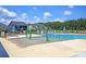 Community pool features splash fountain and lounge chairs for relaxation and fun under the sun at 354 Beachgrass Ln, Summerville, SC 29486