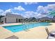 Spacious community pool with lounge chairs, splash fountain, and pristine views for residents at 354 Beachgrass Ln, Summerville, SC 29486