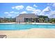 Community pool features lounge chairs, splash fountain, bathhouse, and pristine views for residents at 354 Beachgrass Ln, Summerville, SC 29486
