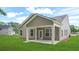 The back exterior shows a covered patio and an ample yard at 403 Cadbury Loop, Summerville, SC 29486