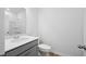 A minimalist bathroom featuring a vanity sink and white toilet, offering a clean and functional space at 403 Cadbury Loop, Summerville, SC 29486