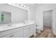 Bright bathroom featuring double sinks, a toilet, and an entrance to the walk-in closet at 403 Cadbury Loop, Summerville, SC 29486