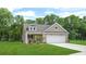 Charming single-Gathering home with a two-car garage, manicured lawn, and mature trees in a desirable neighborhood at 403 Cadbury Loop, Summerville, SC 29486