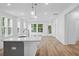 Modern kitchen featuring stainless steel appliances, a center island, and plenty of natural light, perfect for cooking and gatherings at 403 Cadbury Loop, Summerville, SC 29486