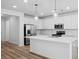 Modern kitchen featuring stainless steel appliances, a center island, and pendant lighting, creating a sleek and inviting cooking space at 403 Cadbury Loop, Summerville, SC 29486