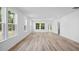 Bright living room featuring beautiful flooring, recessed lighting, and multiple windows offering lots of natural light at 403 Cadbury Loop, Summerville, SC 29486