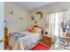 Cozy bedroom with a comfortable bed, natural light, and charming decor at 404 Norwood Ct, Moncks Corner, SC 29461