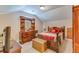 A cozy bedroom featuring a wooden dresser, a bed with colorful quilt, and a sloped ceiling at 404 Norwood Ct, Moncks Corner, SC 29461
