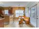 Inviting kitchen and breakfast nook with a wooden bench, ample lighting, and outside access at 404 Norwood Ct, Moncks Corner, SC 29461