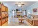 Cozy living room featuring a brick fireplace, comfortable seating, and bright lighting at 404 Norwood Ct, Moncks Corner, SC 29461