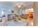 Spacious living room with hardwood floors, comfortable seating, and open layout at 404 Norwood Ct, Moncks Corner, SC 29461