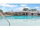 A community pool area with a bath house and covered seating area at 404 Norwood Ct, Moncks Corner, SC 29461