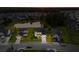 Aerial view of a house at dusk, showcasing the community, and nearby pond at 404 Topcrest Ln, Moncks Corner, SC 29461