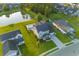 Aerial view of a home with an in-ground pool and a pond in a residential neighborhood at 404 Topcrest Ln, Moncks Corner, SC 29461
