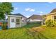 Charming backyard featuring a storage shed with garden accents, complemented by lush greenery and a fenced yard at 404 Topcrest Ln, Moncks Corner, SC 29461