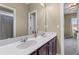 Bathroom featuring double vanity sinks with framed mirror at 404 Topcrest Ln, Moncks Corner, SC 29461