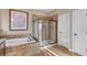 Bathroom with soaking tub, a framed art piece, a walk-in shower, and linen closet at 404 Topcrest Ln, Moncks Corner, SC 29461