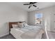 Bright bedroom featuring a queen bed with wooden headboard, plush carpet, and window with natural light at 404 Topcrest Ln, Moncks Corner, SC 29461