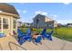 Patio with cozy fire pit and adirondack chairs in a fenced yard, providing a relaxing outdoor experience at 404 Topcrest Ln, Moncks Corner, SC 29461