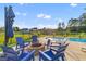 Outdoor fire pit surrounded by Adirondack chairs, perfect for entertaining with scenic views in a fenced yard at 404 Topcrest Ln, Moncks Corner, SC 29461