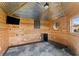 Unique shed interior featuring metal walls, a mini-fridge, tv, and a cozy lounge, blending rustic with comfort at 404 Topcrest Ln, Moncks Corner, SC 29461