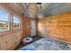 Unique shed interior featuring metal walls, a window, and a cozy lounge, blending rustic with comfort at 404 Topcrest Ln, Moncks Corner, SC 29461