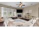 Bright living room with fireplace, a large sectional sofa, and hardwood flooring at 404 Topcrest Ln, Moncks Corner, SC 29461