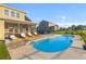 Inviting pool area with sun loungers, offering a relaxing escape with views of the home and landscaped yard at 404 Topcrest Ln, Moncks Corner, SC 29461