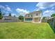 Expansive, fenced backyard with lush green grass, perfect for outdoor activities and relaxation at 412 Beverly Dr, Summerville, SC 29485