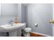 Bathroom with a pedestal sink, toilet, and mirror at 412 Beverly Dr, Summerville, SC 29485
