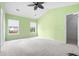 Bright bedroom with neutral carpet, a ceiling fan, and large windows at 412 Beverly Dr, Summerville, SC 29485