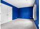 Bedroom with blue walls, carpet, and a closet with double doors for ample storage at 412 Beverly Dr, Summerville, SC 29485