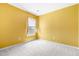 Bedroom with a window and golden walls; a neutral carpet is on the floor at 412 Beverly Dr, Summerville, SC 29485