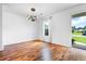 Bright and airy dining room with hardwood floors and a modern chandelier at 412 Beverly Dr, Summerville, SC 29485